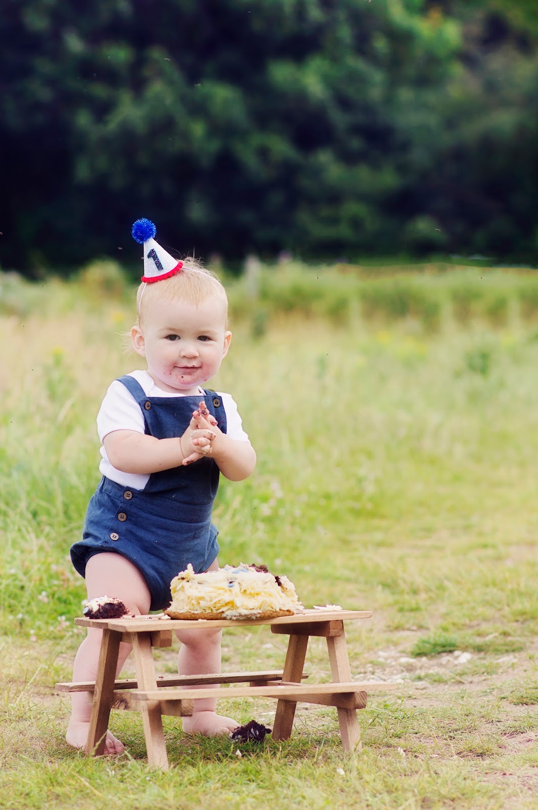 Baby Hero in Elfie Dungarees and Little Blue Olive Hat Cake smash