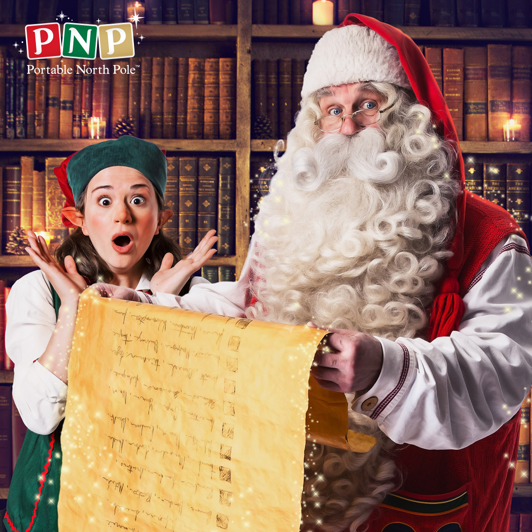 father christmas checking his list at the portable north pole