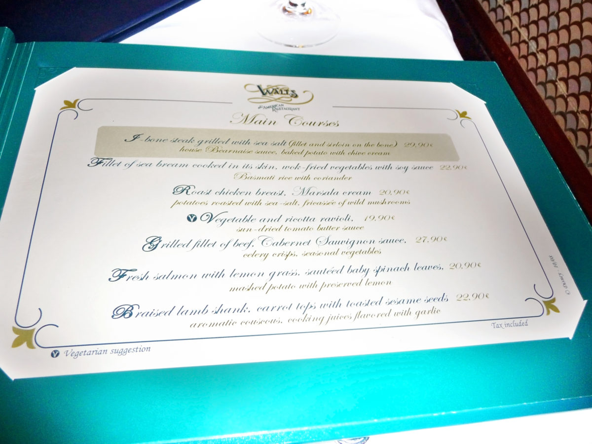 Image shows the inside of the menu at walt's restaurant in disneyland paris. The prices and items are listed.