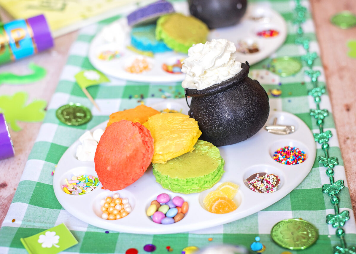 Decorate your own pancake party, with mini rainbow pancakes, sprinkles and cream. Checkered green and white tablecloth fabric for St. Patrick's Day
