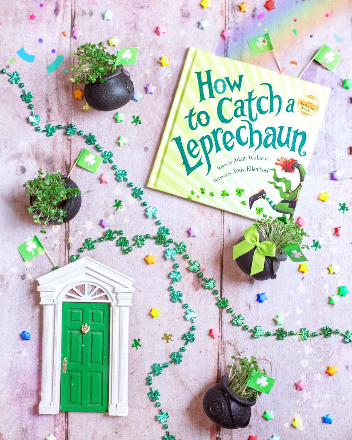 Image shows St. Patrick's Day Leprechaun door, rainbow lucky stars, shamrock in little black cauldon pots of gold, green metallic shamrock necklaces and a  How to Catch a Leprechaun Book. Easy, last minute crafts for celebrating St. Patrick's day with kids complete with supply list.