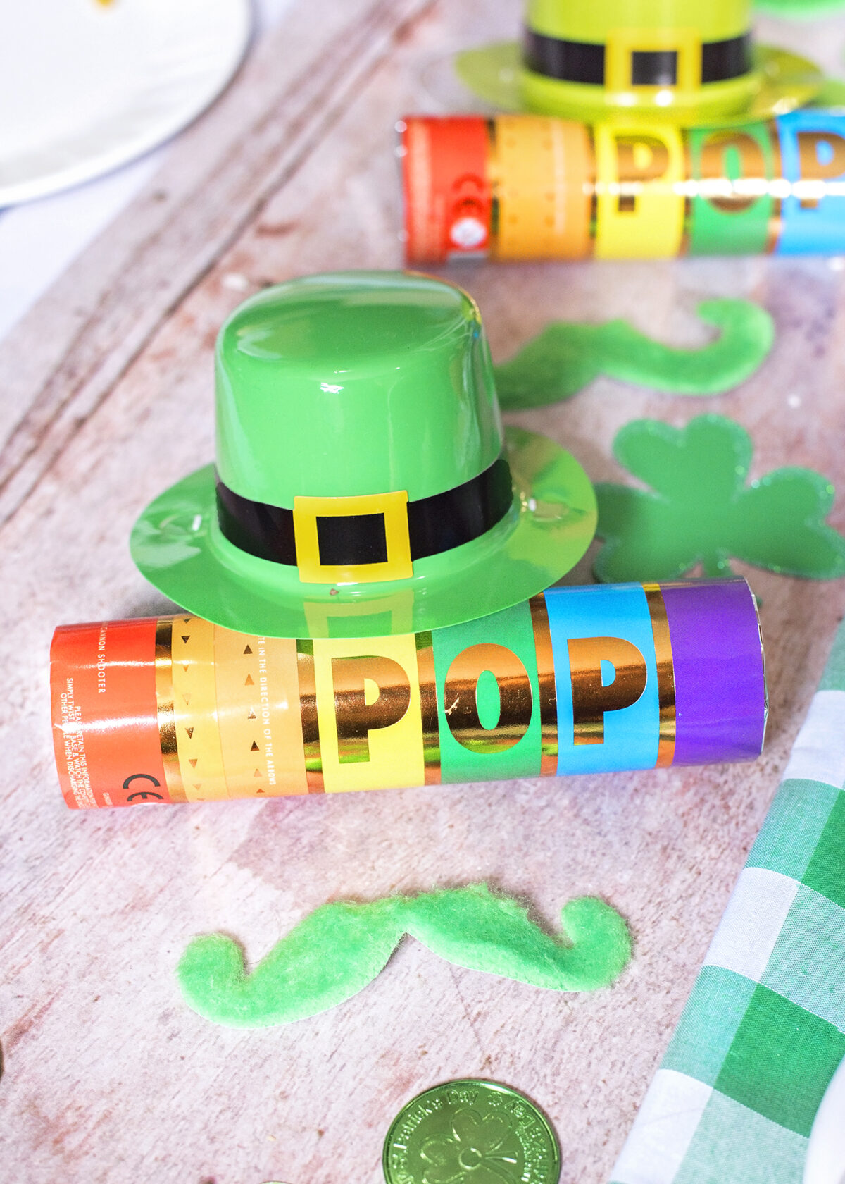 Leprechaun Party Favours. Mini Leprechaun hat, Green Stick on moustache and rainbow confetti party popper cannon.