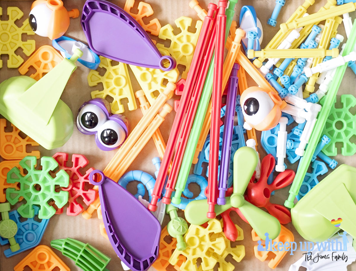Image shows flatlay of the colourful pieces inside the Kid K'nex Budding Builders construction toys box from Basic Fun UK.  By Keep Up With The Jones Family
