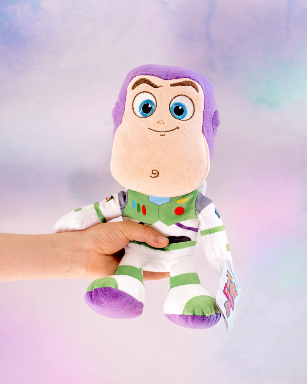 Image shows profile view of Disney Pixar's Toy Story Character Buzz Lightyear as a plush toy from SImba Toys. Image by Keep Up With The Jones Family. 